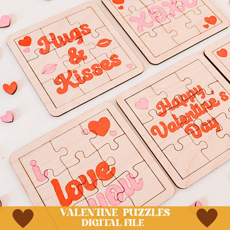 May include: Four wooden Valentine's Day jigsaw puzzles with pink and red lettering. The puzzles feature the phrases "Hugs & Kisses", "I Love You", "Happy Valentine's Day", and "XOX".