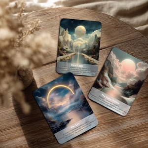 May include: Three oracle cards with celestial landscape art. The cards feature imagery of a moon, mountains, and a glowing arch. Each card has text with affirmations and messages. The cards are on a wooden surface.