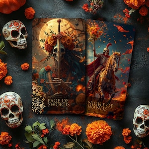 May include: Two tarot cards, "Page of Swords" and "Night of Wands", feature skeletal figures in ornate attire. The cards are surrounded by Day of the Dead skulls, orange flowers, and greenery, set against a dark background.