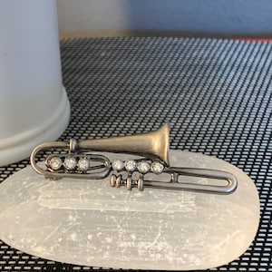 Vintage Silver Tone and Rhinestone Trumpet Brooch.