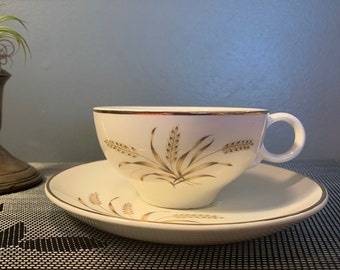 Vintage Universal Potteries Ballerina Wheat Pattern with Gold on Creamy White Teacup and Saucer
