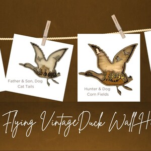 May include: Four vintage duck wall hangings with a rustic woodgrain finish. Each hanging features a different scene, including a father and son, a hunter and dog, and a hunter in cattails. The hangings are displayed on a clothesline with clothespins.