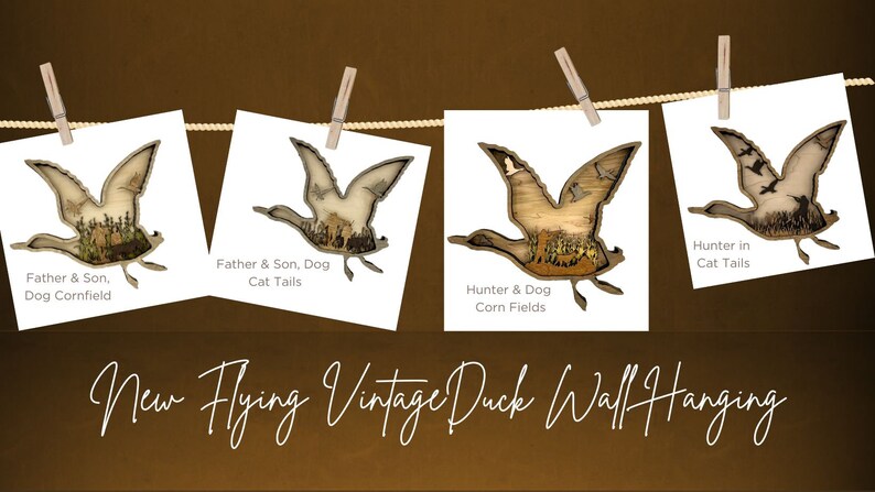 May include: Four vintage duck wall hangings with a rustic woodgrain finish. Each hanging features a different scene, including a father and son, a hunter and dog, and a hunter in cattails. The hangings are displayed on a clothesline with clothespins.