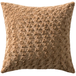 May include: A square, tan-colored decorative pillow. The pillow has a textured surface with a pattern of small, raised, rose-like designs. The pillow is made of a soft, plush material, and is likely used for home decor.