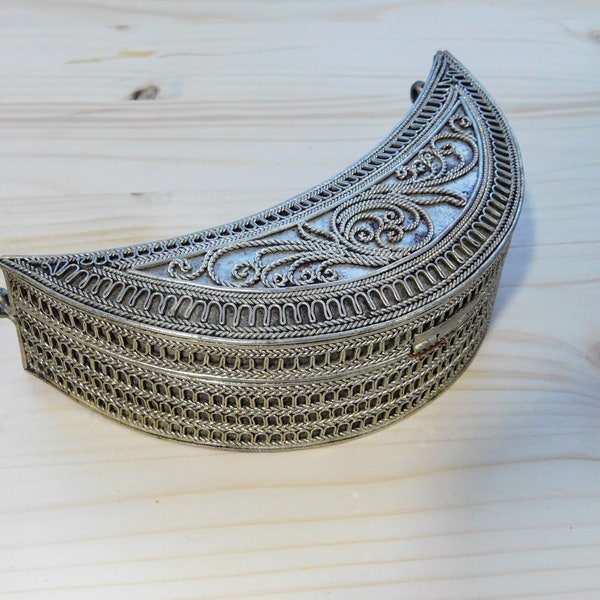 The ethnic casket is decorated with filigree. Coin box. Box for paints. Ethnic jewelry. Collection box. Filigree casket shaped crescent moon