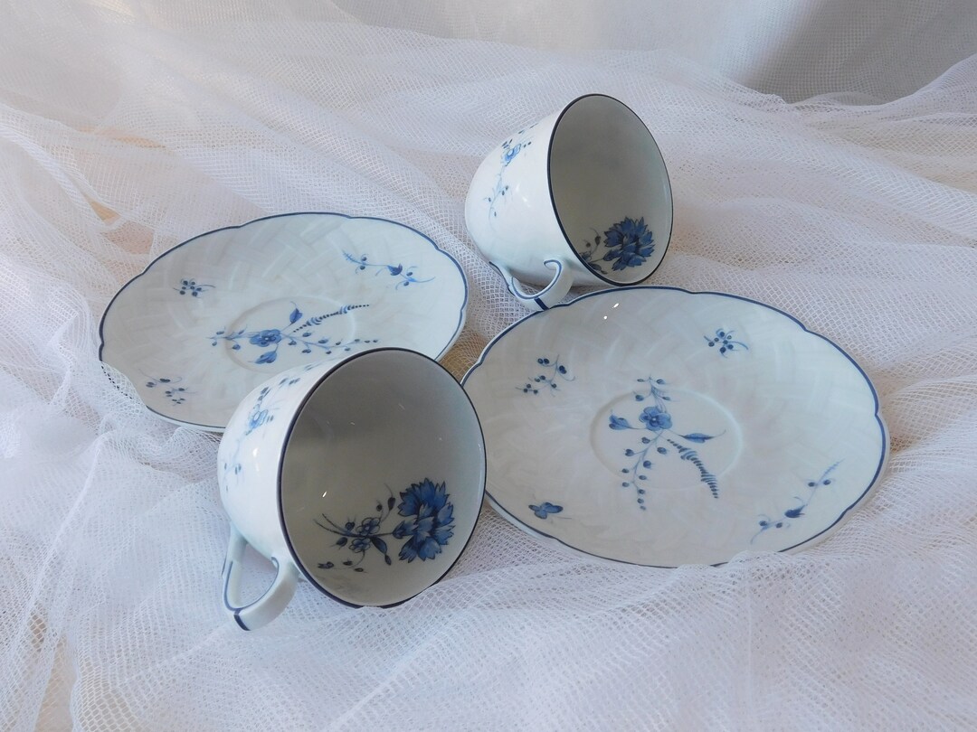 A Pair of White and Blue Antique Limoges Coffee Cups and Saucers