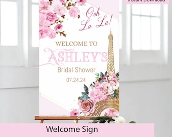 Puede incluir: Un cartel de bienvenida imprimible para una despedida de soltera con un diseño de Torre Eiffel rosa y dorada. El texto dice "Ooh La La! Bienvenida a la despedida de soltera de Ashley 07.24.24".