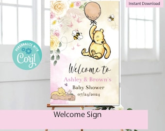 May include: A Winnie the Pooh themed baby shower welcome sign with a pink and yellow floral design. The sign features Winnie the Pooh holding a balloon and the text "Welcome to Ashley & Brown's Baby Shower 07/24/2024".