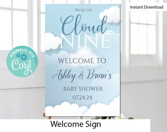 May include: A blue and white welcome sign with clouds and stars. The text reads "We're on Cloud Nine, Welcome to Ashley & Brian's Baby Shower 07.24.24".