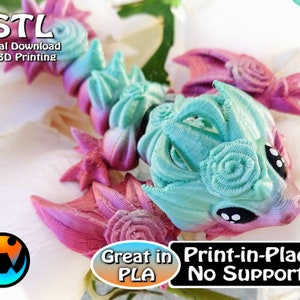 May include: A 3D-printed dragon figurine in shades of pink, teal, and purple. The dragon has a detailed, textured design with rose-like features. Text on the image reads '.STL Digital Download for 3D Printing' and 'Great in PLA Print-in-Place No Supports'.