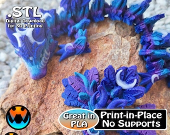 May include: A 3D printed model of a dragon with a blue and purple color scheme. The dragon is curled up with its head resting on a rock. The model is printed in place and does not require supports. The text "STL Digital Download for 3D Printing" is visible in the top left corner of the image. The text "Great in PLA Print-in-Place No Supports" is visible in the bottom right corner of the image.
