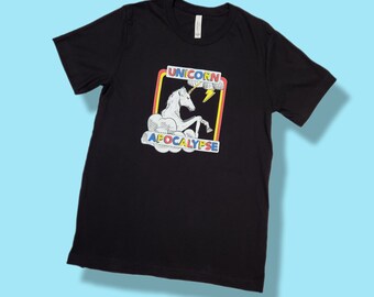 Unicorn Apocalypse T-Shirt. Black shirt with character graphic. Sizes XS - 2XL available.
