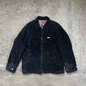 May include: A black corduroy jacket featuring a full-length front zip, a standard collar, and two side pockets. The jacket includes a small white rectangular brand tag on the chest and a red interior label with the text Chevignon.