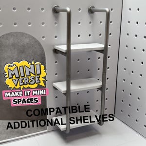 May include: Miniature white shelves with a silver metal frame. The shelves are designed to be compatible with MGA's Mini Verse Make It Mini Spaces. The image also includes the text "Compatible Additional Shelves".