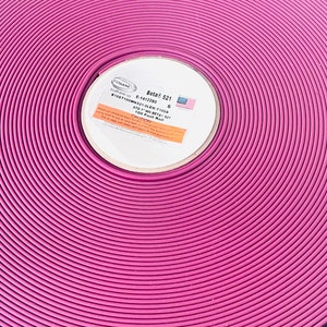 May include: A roll of pink Beta 521 100 foot roll of 6 inch wide trim. The label reads "Beta 521 6" and "100 foot roll Beta 521".