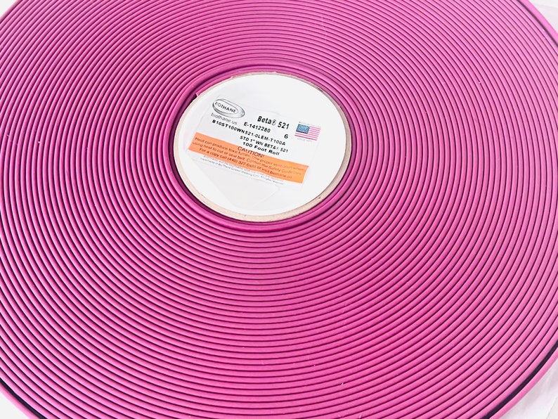 May include: A roll of pink Beta 521 100 foot roll of 6 inch wide trim. The label reads "Beta 521 6" and "100 foot roll Beta 521".