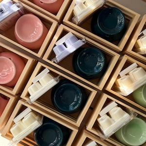 Soy wax melts with ceramic wax melters arranged in wooden boxes, natural home fragrance set