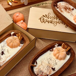 Handmade wooden dough bowl pumpkin candle with soy wax and dried botanicals, perfect as an autumn candle or pumpkin candle gift. Rustic design enhances autumn home decor and autumn decorations, while warm fragrance makes it an ideal Thanksgiving candle. Use as pumpkin decor, cozy centerpiece, or thoughtful Thanksgiving gifts. Unique handmade candles for Thanksgiving decor and seasonal charm, reusable rustic bowl.