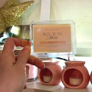 Hand holding ceramic wax melter, minimalist wax burner for home fragrance