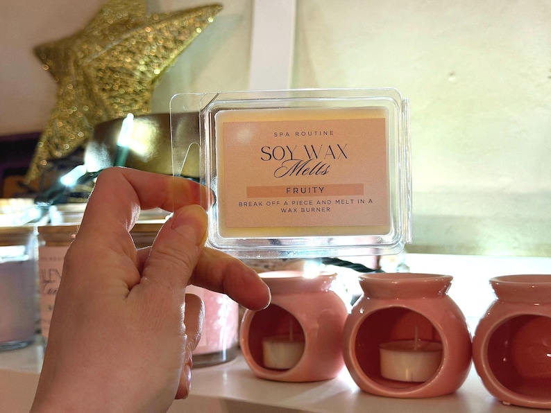 Hand holding ceramic wax melter, minimalist wax burner for home fragrance