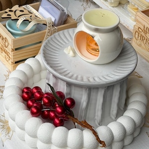 Placing soy wax melts into ceramic wax burner, easy aromatherapy home fragrance use