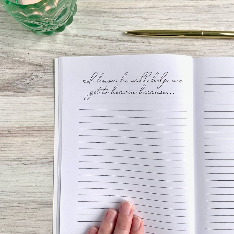 May include: An open journal with lined pages and the text "I know he will help me get to heaven because..." written in black ink.