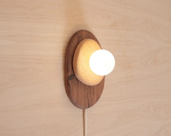 Pebble plug in wall sconce