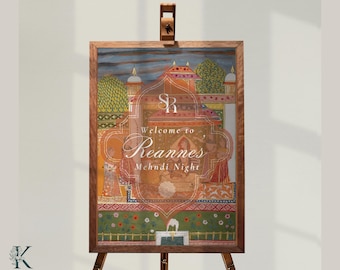 May include: A rectangular wooden sign on an easel featuring a colorful illustration of a palace courtyard with figures in traditional attire. The text reads "SR Welcome to Reannes Mehndi Night" in white script and serif fonts centered on the artwork.