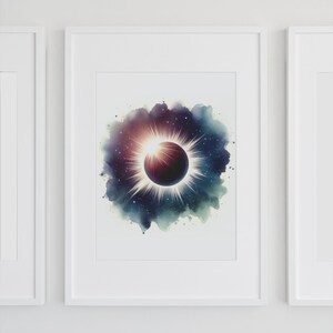 May include: A framed watercolour painting of a solar eclipse with a dark purple and black sun and a bright white halo. The background is a dark blue and green watercolour wash with white stars.