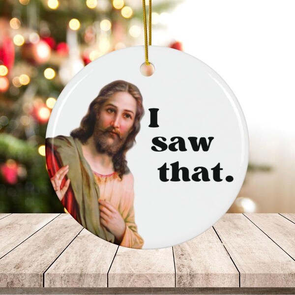 May include: White ceramic Christmas bauble featuring an image of Jesus and the text "I saw that."
