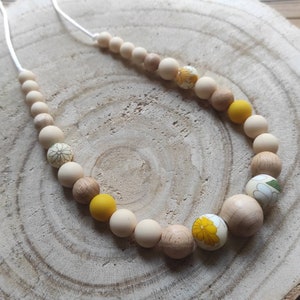 Breastfeeding and baby bottle-feeding necklace, silicone and wood, beige, mustard yellow, floral