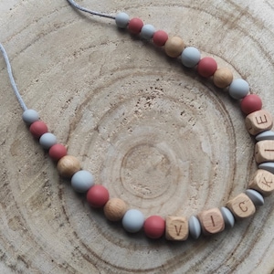 Collar lactancia y portabebé silicona gris madera terracota nombre