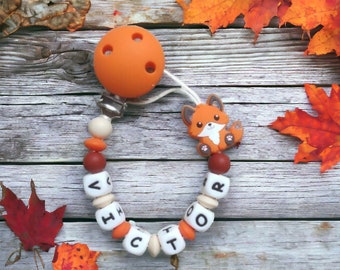Orange fox pacifier clip