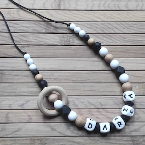 Nursing and bottle carrying necklace silicone wood white and black hook first name