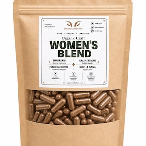 May include: A brown paper bag with a clear window showing many brown capsules. The bag is labelled "Organic Craft Women's Blend" and lists ingredients. The packaging is marked as vegan and eco-friendly.
