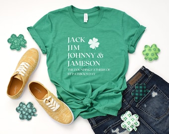 May include: Green t-shirt with white text that reads "Jack Jim Johnny & Jameson The Founding Fathers of St. Patrick's Day" and a white four-leaf clover graphic.
