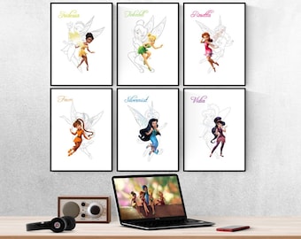 May include: Six black and white framed prints of fairies with their names above them:  Tinkerbell, Rosetta, Fawn, Silvermist, Vidia, and Iridessa. The prints are hanging on a white wall above a wooden desk with a laptop, headphones, and a vintage radio.