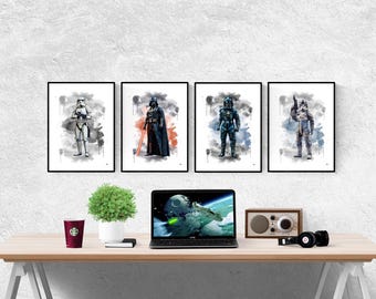 May include: Four framed watercolor prints of Star Wars characters: a Stormtrooper, Darth Vader, a Mandalorian, and a Rebel pilot. The prints are displayed above a desk with a laptop, plant, radio, headphones, and a coffee cup.