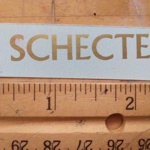 2e goud metallic inkt waterglijbaan sticker gitaarkop