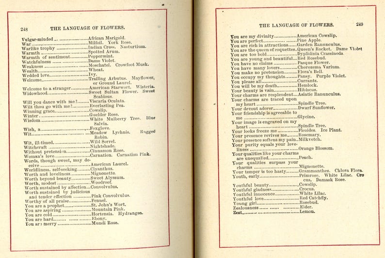 May include: Open book pages displaying lists of flower meanings from "The Language of Flowers." Text is in black font on aged, cream-colored paper. The left page lists meanings like "War" and "Weakness." The right page lists meanings like "You are perfect" and "Youthful beauty."