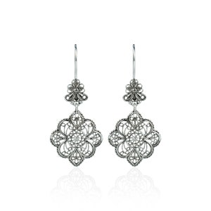 May include: A pair of silver filigree earrings with a floral design. The earrings are dangle style and have a small flower charm at the top.