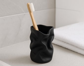 Matzwarte 3D-geprinte tandenborstelhouder – gebeeldhouwde organische toilettafel