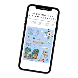 May include: A smartphone screen displaying a blue background with illustrations of various landmarks and attractions in Aix-en-Provence, France. The text "SLOWING OUT AIX-EN-PROVENCE" is at the top of the screen. The text "CARNET D'ADRESSES RESPONSABLES RECOMMANDÉES PAR DES FEMMES LOCALES & ENGAGÉES" is below the title.
