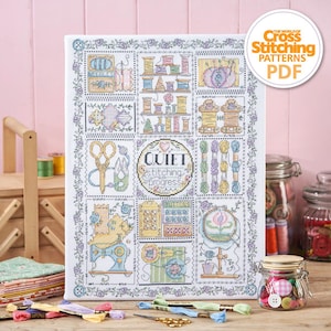May include: A white canvas with a cross stitch pattern of sewing themed images. The pattern includes a sewing machine, buttons, needles, thread, and the text "Quiet stitching in progress".