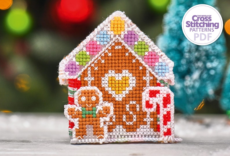 May include: A cross stitch pattern for a gingerbread house with candy details and a gingerbread man. The pattern is in PDF format and is from The World of Cross Stitching Patterns.