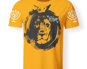 May include: A yellow t-shirt with a black and white lion graphic on the front. The graphic includes the text "Tribe of Judah" and a menorah symbol. The sleeves of the shirt also feature a menorah symbol.