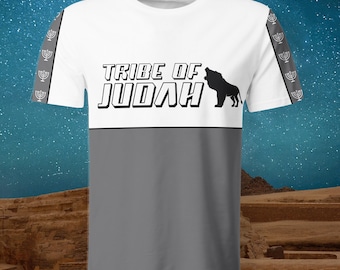 May include: White and gray t-shirt with the text "TRIBE OF JUDAH" and a lion silhouette. The sleeves have a gray stripe with a menorah pattern. The shirt has a two-tone design, with a white upper section and a gray lower section.
