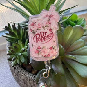 Pink Dr. Pepper can badge reel