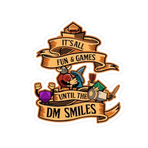 Puede incluir: Una pegatina con una ilustración de dibujos animados de dados y una pancarta que dice "It's all fun & games until the DM smiles".