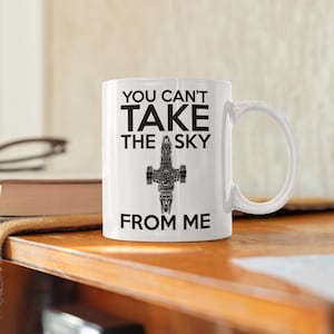 May include: White ceramic mug with a black graphic of a spaceship and the text "You can't take the sky from me".